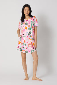 A Lady Wearing Tropical Daydream Stretch Jersey T-shirt Sleep Dress facing front in a standing pose