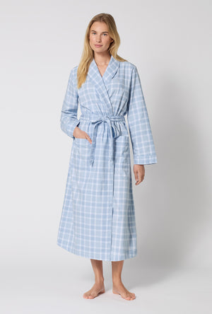 A lady wearing Meadow Haze Plaid Unisex Classic Woven Portuguese Flannel Robe De Chambre