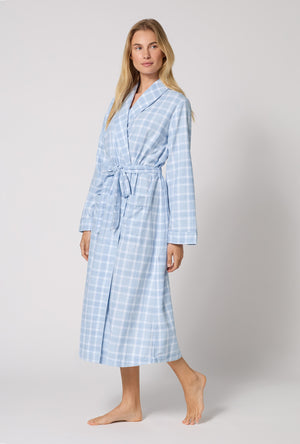 A lady wearing Meadow Haze Plaid Unisex Classic Woven Portuguese Flannel Robe De Chambre looking side