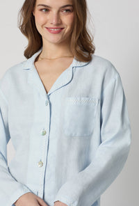A closeup of A lady wearing Baby's Breath Blue Long Sleeve Classic Woven Linen Pj Set