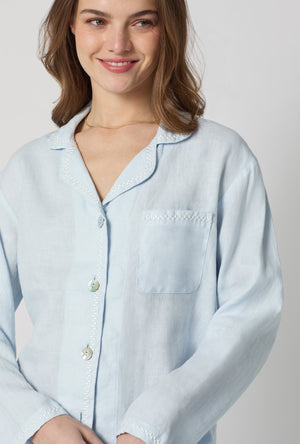 A closeup of A lady wearing Baby's Breath Blue Long Sleeve Classic Woven Linen Pj Set