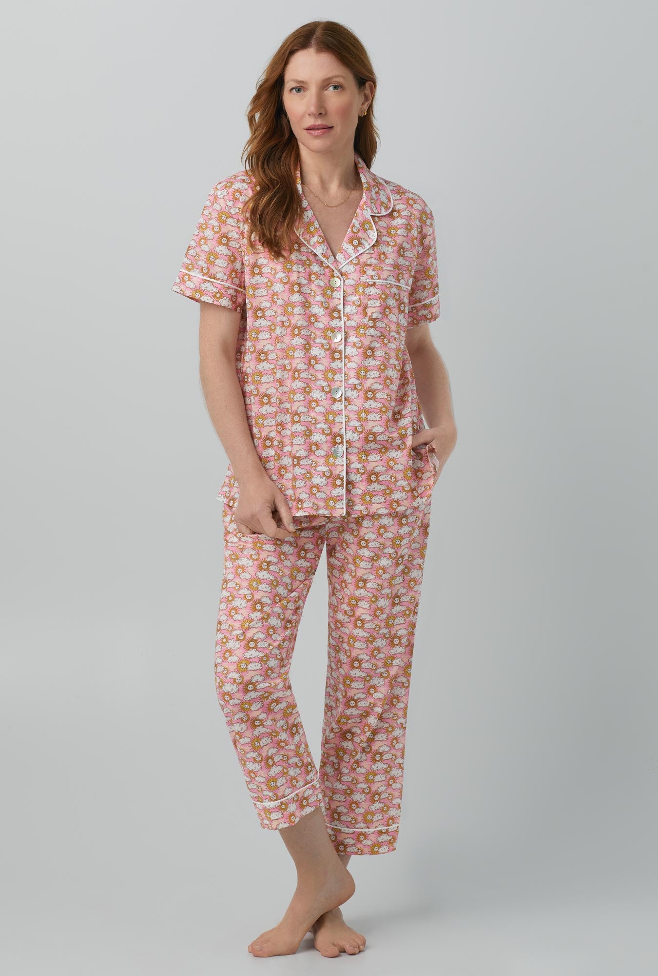 A lady wearing Follow The Sun Short Sleeve Classic Woven Cotton Tana Lawn® Cropped PJ Set Made with Liberty Fabrics