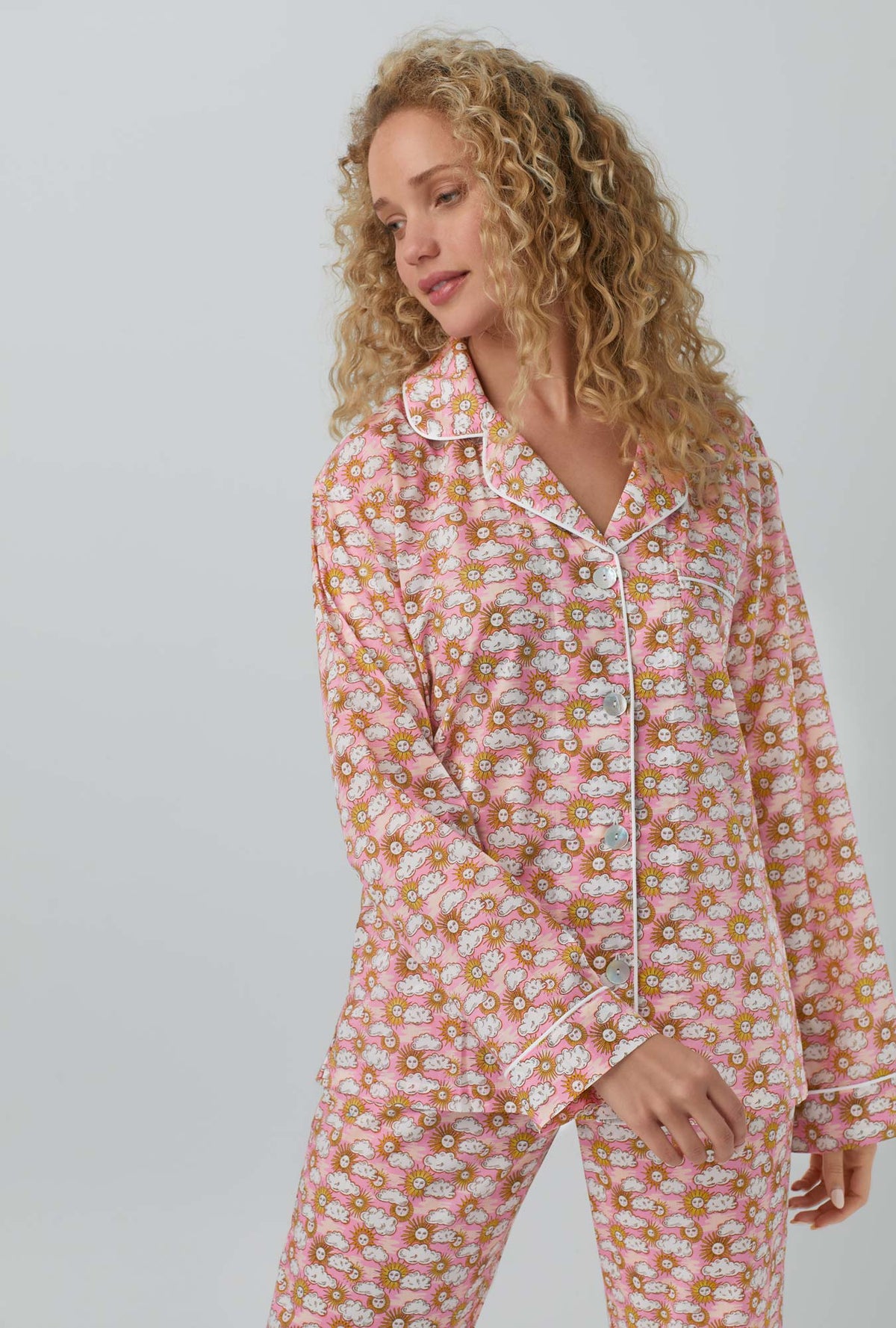 A lady wearing Follow The Sun Long Sleeve Classic Woven Cotton Tana Lawn® PJ Set Made with Liberty Fabrics