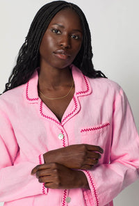 A closeup of A lady wearing Pink Long Sleeve Classic Woven Linen Pj Set