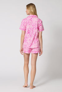 A Lady Wearing Valentina Leopard Short Sleeve Classic Shorty Stretch Jersey Pj Set in a back view pose