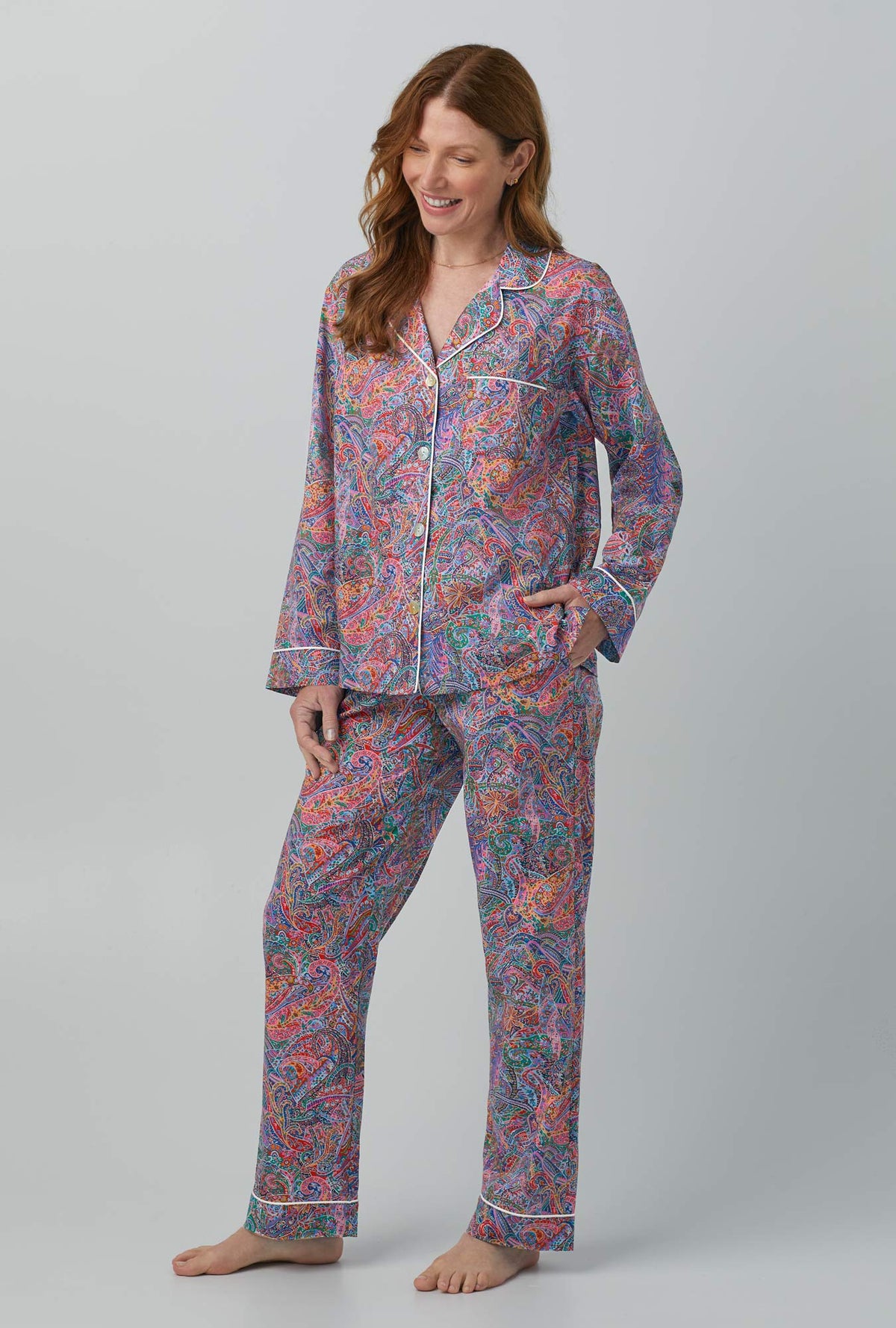 A lady wearing Dana Sharmin Long Sleeve Classic Woven Cotton Tana Lawn® PJ Set Made with Liberty Fabrics