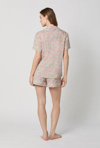 A lady wearing Emma & Georgina Short Sleeve Classic Shorty Woven Tana Lawn® PJ Set Made with Liberty Fabric back view