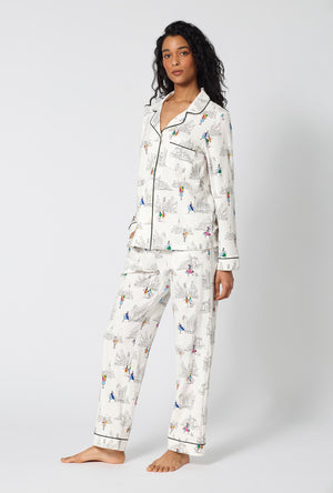 A Lady Wearing Nordstrom Shoppers Long Sleeve Classic Stretch Jersey Pj Set in a side angled pose