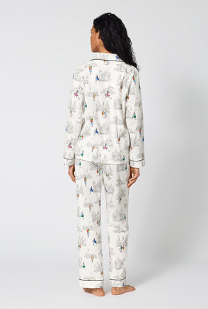 A Lady Wearing Nordstrom Shoppers Long Sleeve Classic Stretch Jersey Pj Set in a back view pose