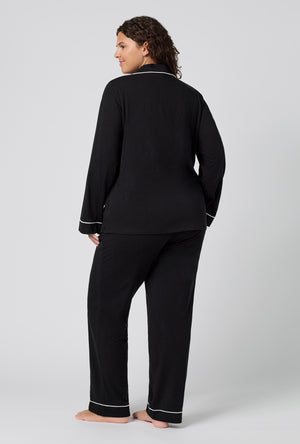 A lady wearing plus size Black Beauty Long Sleeve Classic Stretch Jersey Pj Set back view