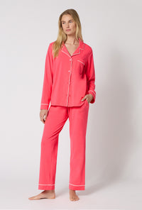 A lady wearing Coral Red Long Sleeve Classic Stretch Jersey Pj Set looking side