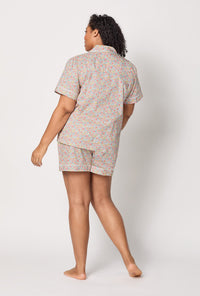 A lady wearing plus size Emma & Georgina Short Sleeve Classic Shorty Woven Tana Lawn® PJ Set Made with Liberty Fabric Back view