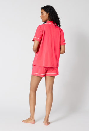 A lady wearing Coral Red Short Sleeve Classic Shorty Stretch Jersey Pj Set back view