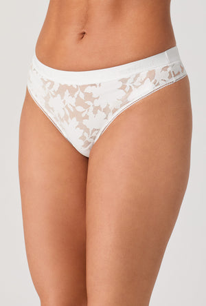 A lady wearing White Stretch Lace Thong Underwear