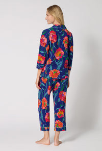 A Lady Wearing BedHead x Trina Turk Linear Poppy 3/4 Sleeve Classic Stretch Jersey Cropped Pj Set in a back view pose