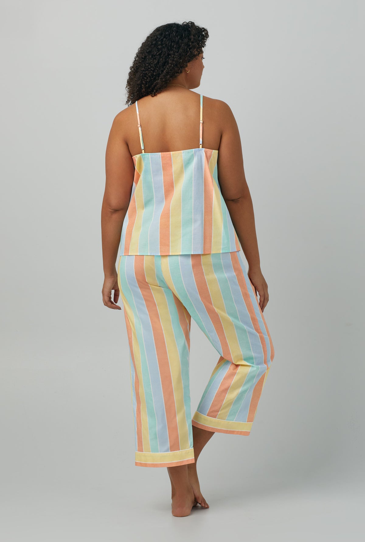 A lady wearing plus size multi color Tank Woven Cotton Poplin Cropped PJ Set with Sunset Stripe print