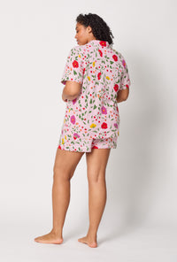 A lady wearing plus size Sunlit Floral Short Sleeve Classic Shorty Stretch Jersey Pj Set
