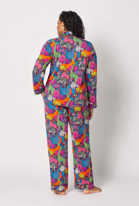 A lady wearing plus size BedHead x Trina Turk Jungle Long Sleeve Classic Stretch Jersey Pj Set
