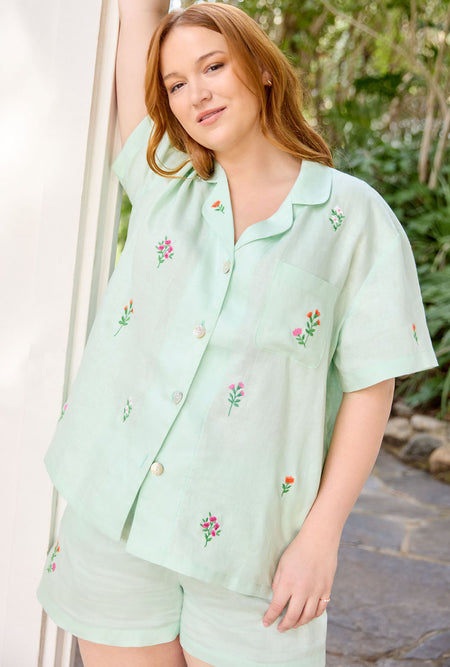 A lady wearing green  Short Sleeve Classic Shorty Woven Linen PJ Set with mint  print.