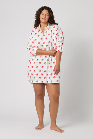 A Lady Wearing Plus Size Celeste High Low Woven Supersoft Cotton Poplin Boyfriend Shirt in a front view pose