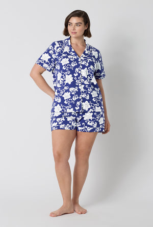 A Lady Wearing Plus Size Dynasty Blue Short Sleeve Classic Shorty Stretch Jersey Pj Set