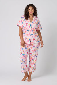 A Lady Wearing Plus Size Serene Sunrise Short Sleeve Classic Stretch Jersey Cropped Pj Set