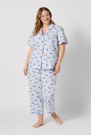 A lady wearing plus size Catch A Wave Snoopy Short Sleeve Classic Woven Cotton Poplin Cropped Pj Set
