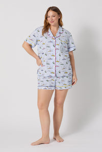 A lady wearing plus size Catch A Wave, Snoopy Short Sleeve Classic Woven Cotton Poplin Shorty Pj Set