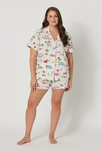 A lady wearing plus size Festive Flamingos Short Sleeve Classic Shorty Stretch Jersey Pj Set