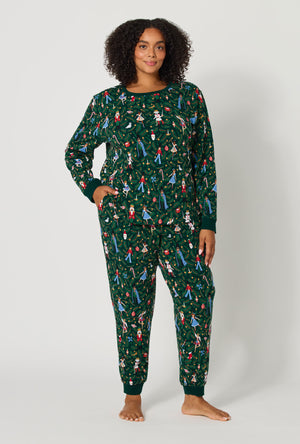 A lady wearing plus size Rifle Paper Co. x BedHead PJs Nutcracker Long Sleeve Pullover Crew And Jogger Stretch Jersey Pj Set