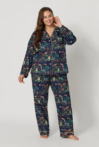 A lady wearing plus size Rifle Paper Co. x BedHead PJs Nativity Long Sleeve Classic Woven Cotton Poplin Pj Set