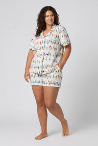 A lady wearing plus size Run NYC Run Short Sleeve Classic Shorty Stretch Jersey Pj Set