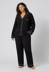 A lady wearing plus size Black Beauty Long Sleeve Classic Stretch Jersey Pj Set