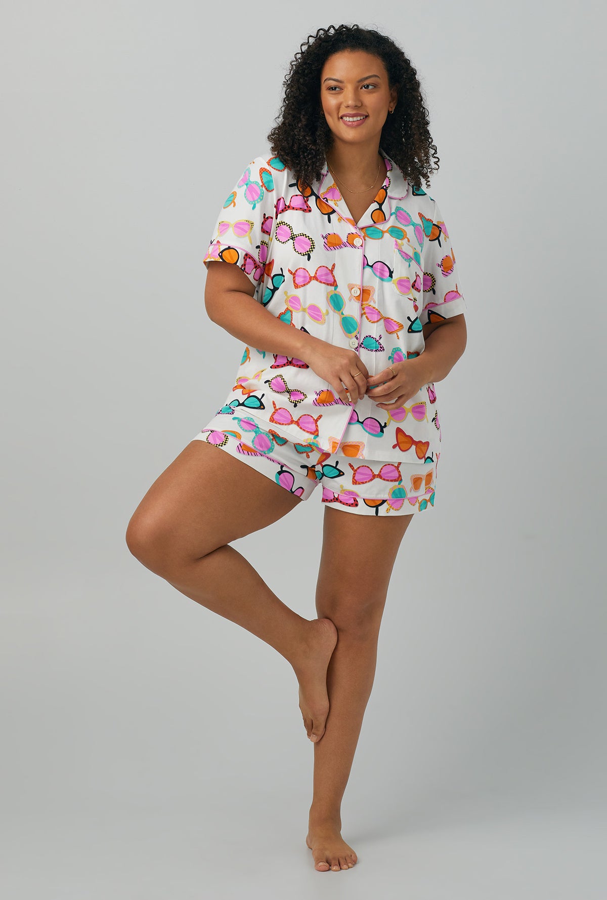 A lady wearing plus size multi color  Short Sleeve Classic Shorty Stretch Jersey PJ Set with Sunny Lens print