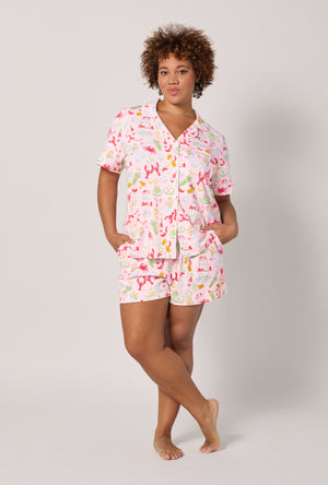 A lady wearing plus size French Quarter Short Sleeve Classic Shorty Stretch Jersey Pj Set