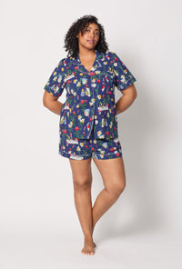 A lady wearing plus size Alice's Adventures Short Sleeve Classic Shorty Stretch Jersey Pj Set