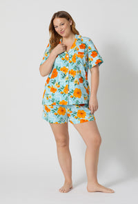 A lady wearing plus size Golden Breeze Short Sleeve Classic Shorty Stretch Jersey Pj Set