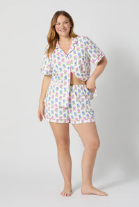 A lady wearing plus size Cottage Parlor Short Sleeve Classic Shorty Stretch Jersey Pj Set back view