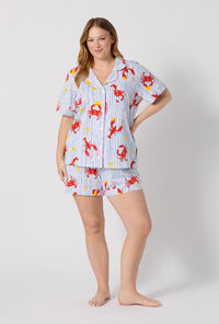 A lady wearing plus size Coastal Feast Short Sleeve Classic Shorty Stretch Jersey Pj Set
