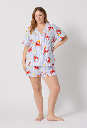 A lady wearing plus size Coastal Feast Short Sleeve Classic Shorty Stretch Jersey Pj Set