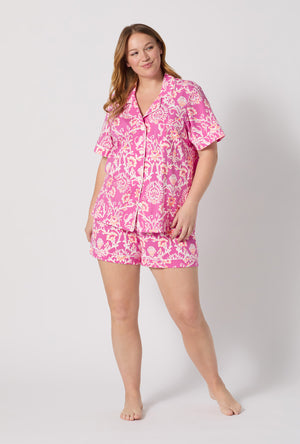 A Lady Wearing Plus Size Luxe Leopard Short Sleeve Classic Shorty Stretch Jersey Pj Set facing front in a full standing pose