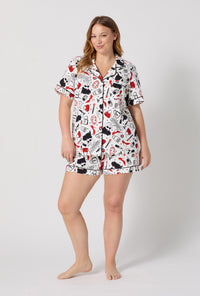 A lady wearing plus size Devil Wears Prada Short Sleeve Classic Shorty Stretch Jersey Pj Set