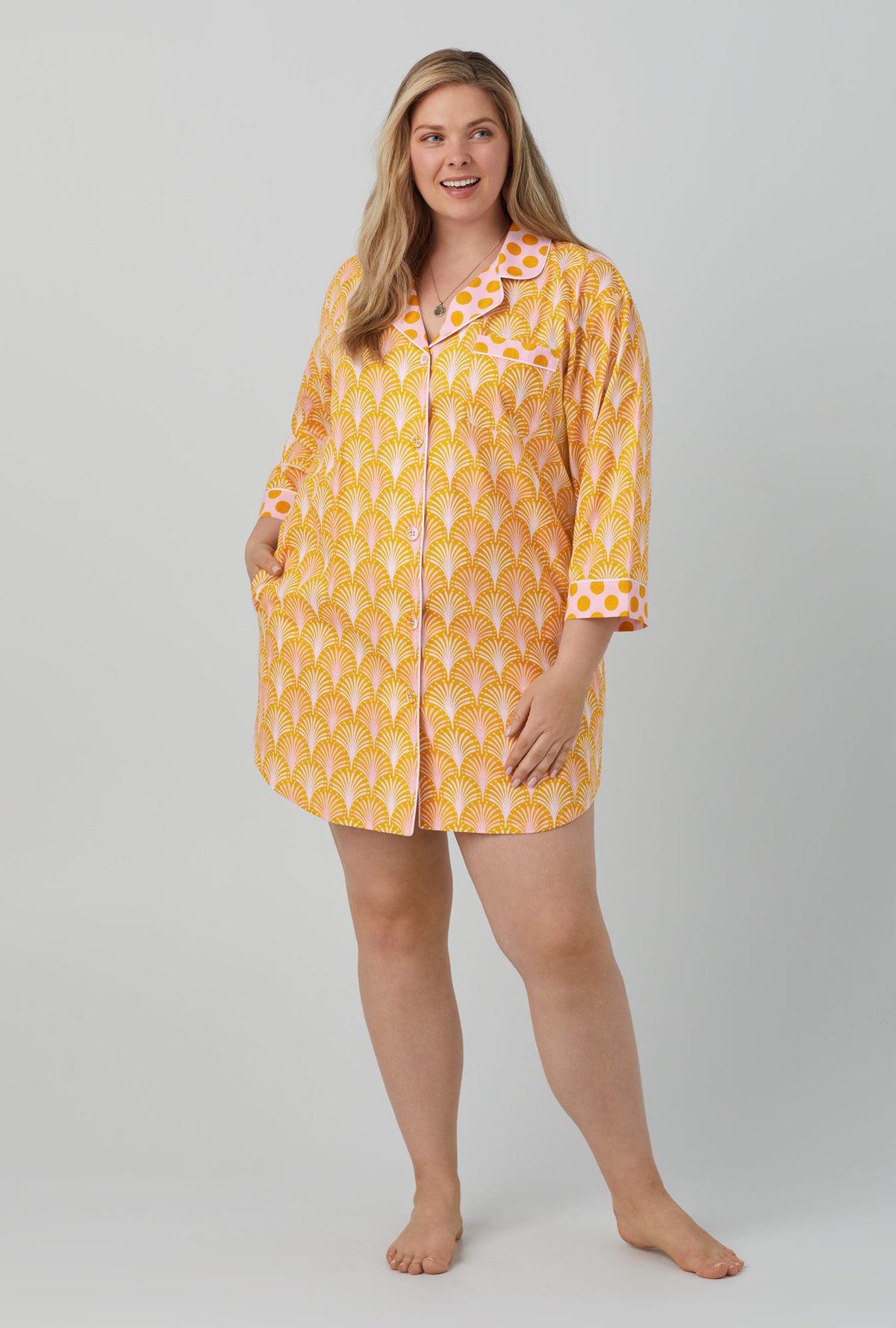 A lady wearing 3/4 sleeve classic woven cotton poplin sleepshirt with suite life print
