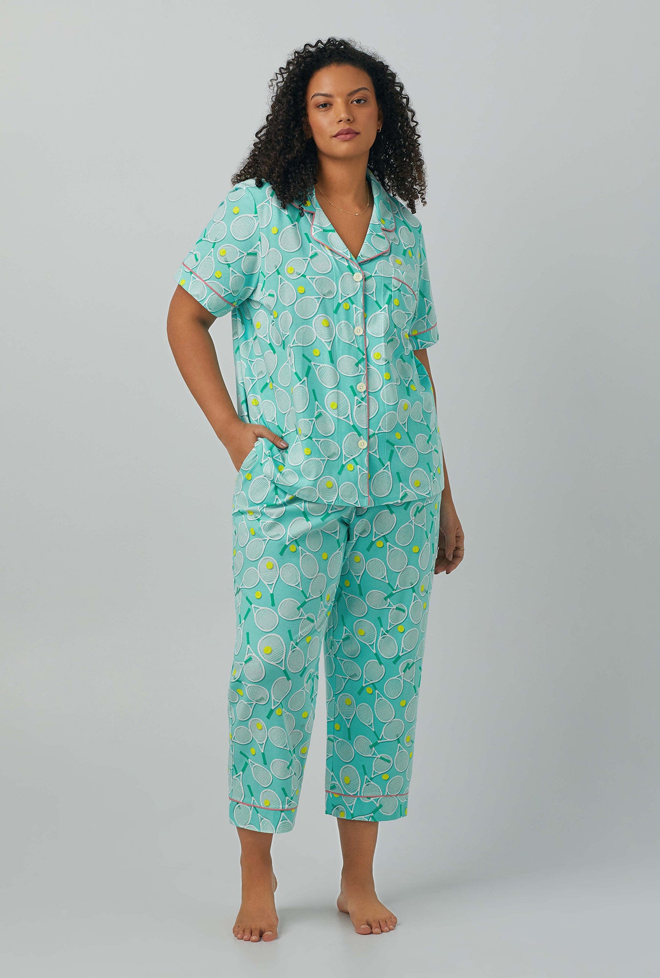 A lady wearing green Short Sleeve Classic Stretch Jersey Cropped PJ Set with Tennis Club print