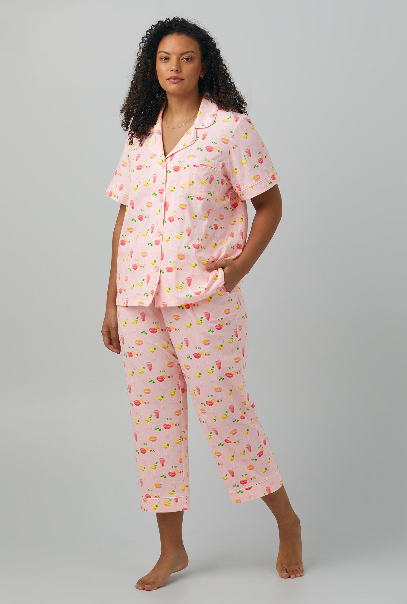 A lady wearing pink  Short Sleeve Classic Stretch Jersey Cropped PJ Set with Pink Mixology print