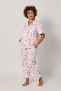 A lady wearing plus size New York, New York Short Sleeve Classic Stretch Jersey Cropped Pj Set