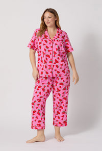 A lady wearing plus size Watermelon Crush Short Sleeve Classic Stretch Jersey Cropped Pj Set