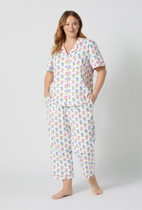 A lady wearing plus size Cottage Parlor Short Sleeve Classic Stretch Jersey Cropped Pj Set