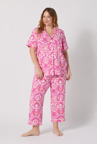 A Lady Wearing Plus Size Luxe Leopard Short Sleeve Classic Stretch Jersey Cropped Pj Set facing front in a full standing pose