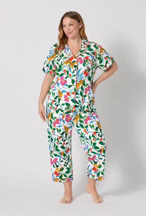 A Lady Wearing Plus Size Jungle Serenade Short Sleeve Classic Stretch Jersey Cropped Pj facing front in a standing pose
